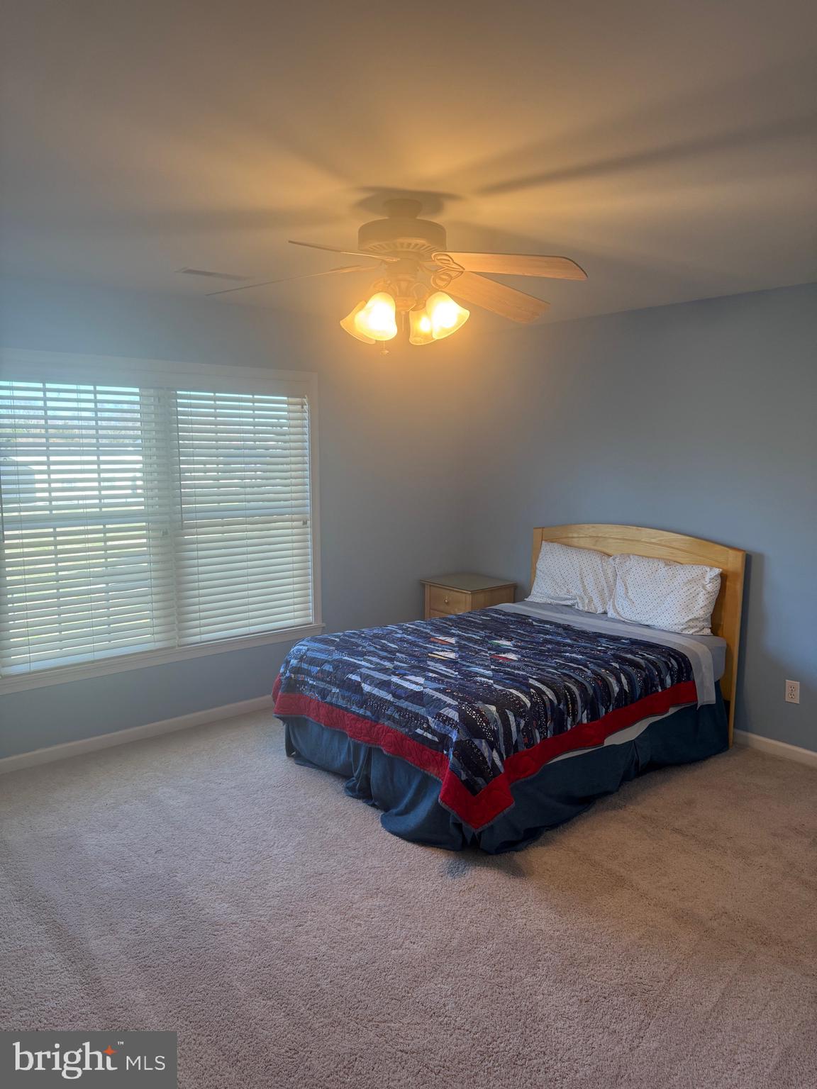 38211 Marlington Road Ocean View, DE 19970 - Photo 32 of 56 a bedroom with a bed and window