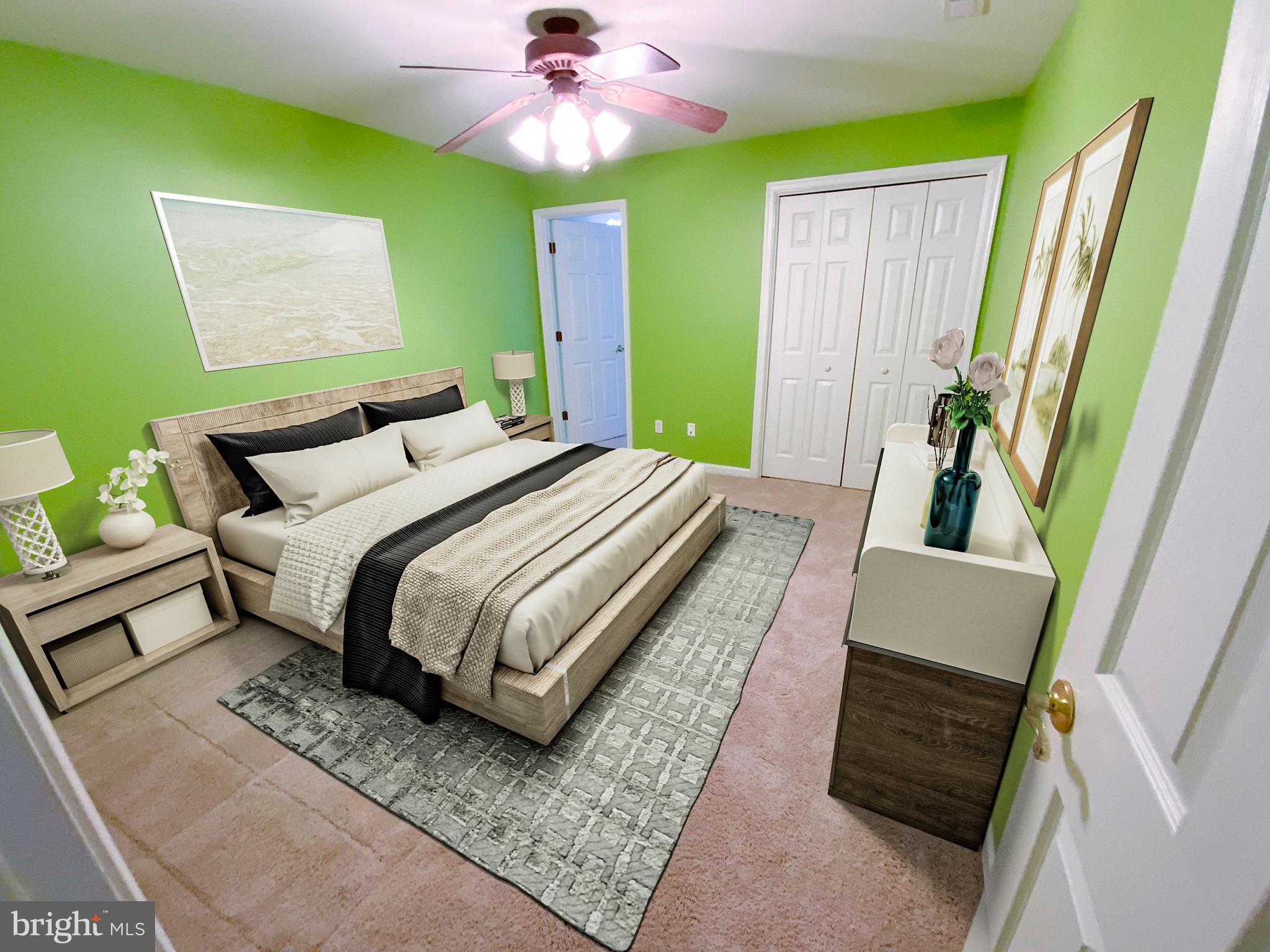 38211 Marlington Road Ocean View, DE 19970 - Photo 37 of 56 a bedroom with a bed and a mirror