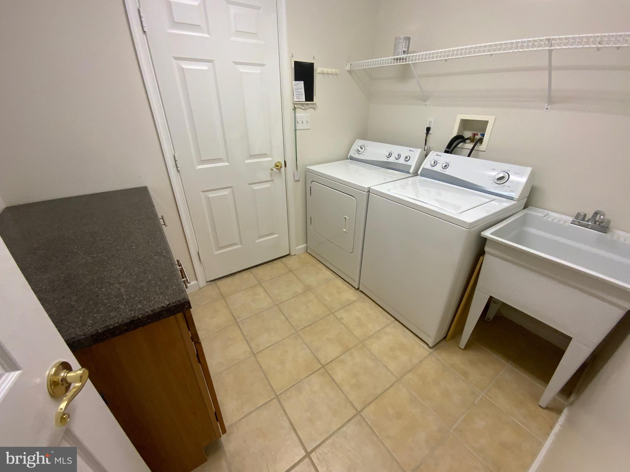 38211 Marlington Road Ocean View, DE 19970 - Photo 41 of 56 a utility room with dryer and washer