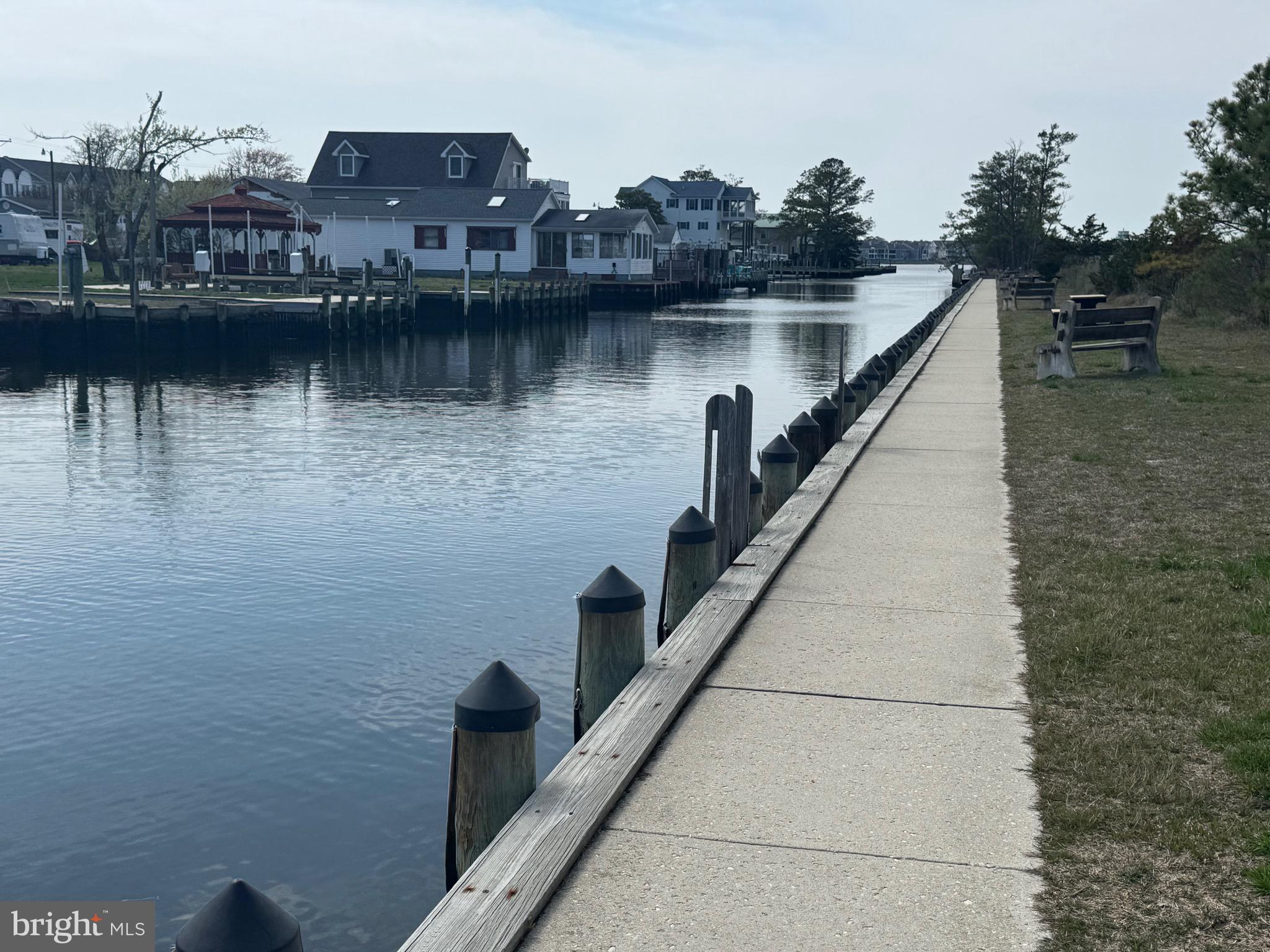38211 Marlington Road Ocean View, DE 19970 - Photo 51 of 56 a view of a lake next to a building