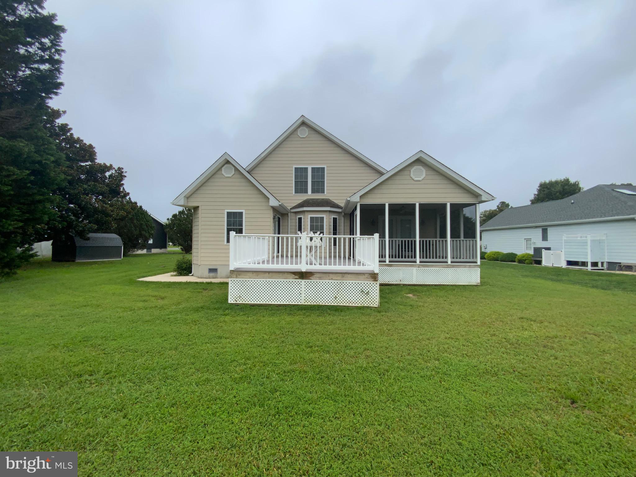 38211 Marlington Road Ocean View, DE 19970 - Photo 6 of 56 a view of a house with a big yard