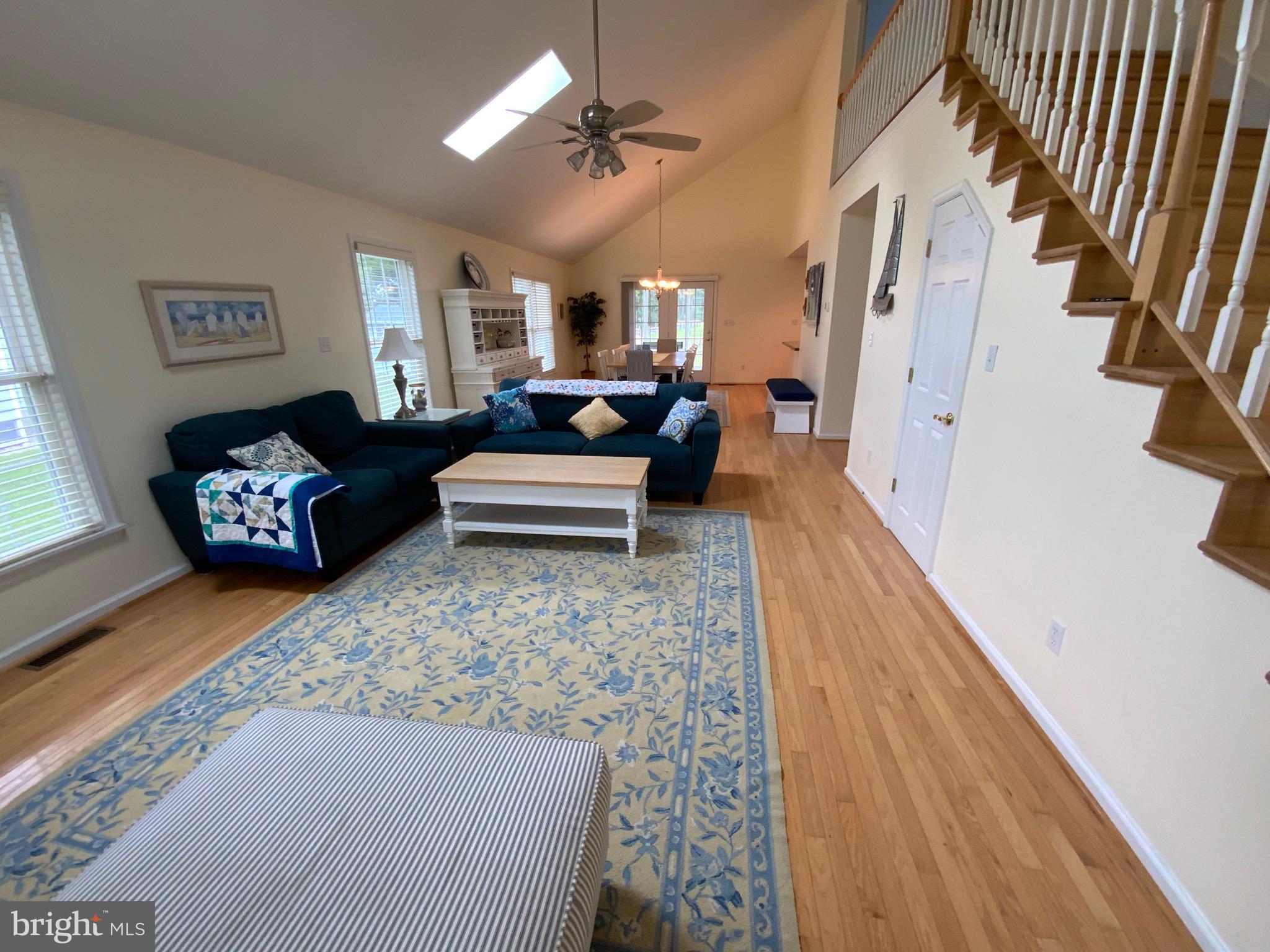 38211 Marlington Road Ocean View, DE 19970 - Photo 8 of 56 a living room with furniture fireplace and rug