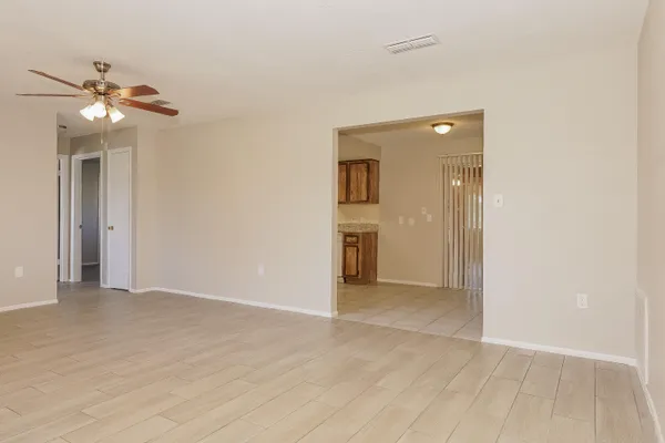 a view of an empty room with a window