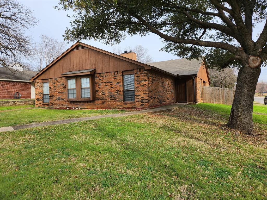 232 South Pipeline Road West, Unit 232 Euless, TX 76040 - Photo 1 of 1 a front view of house with yard and green space