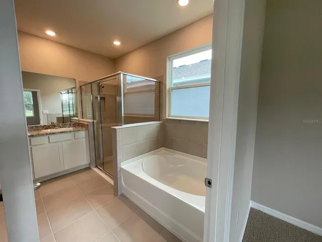 a view of a bedroom from a hallway