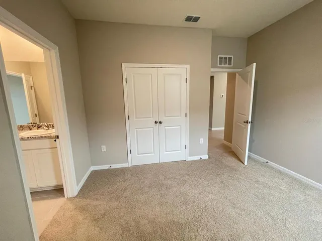 a white toilet and tub sitting next to a bathroom sink