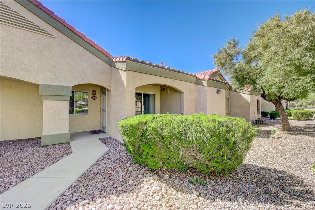 7885 West Flamingo Road, Unit 1050 Las Vegas, NV 89147 - Photo 2 of 62 A terracotta-tiled roof and stucco exterior welcome you home.