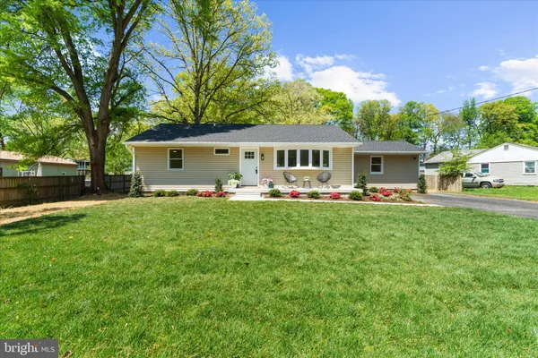 a front view of a building with parking