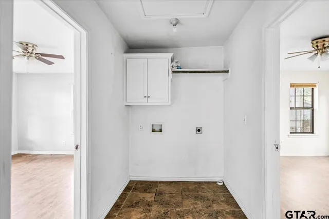 a view of an empty room with a window