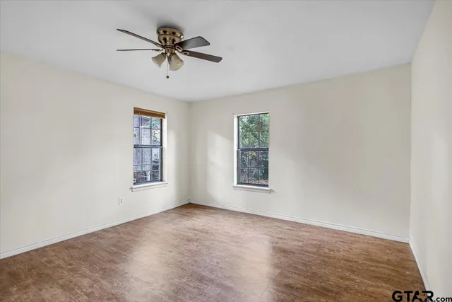 a view of empty room with windows