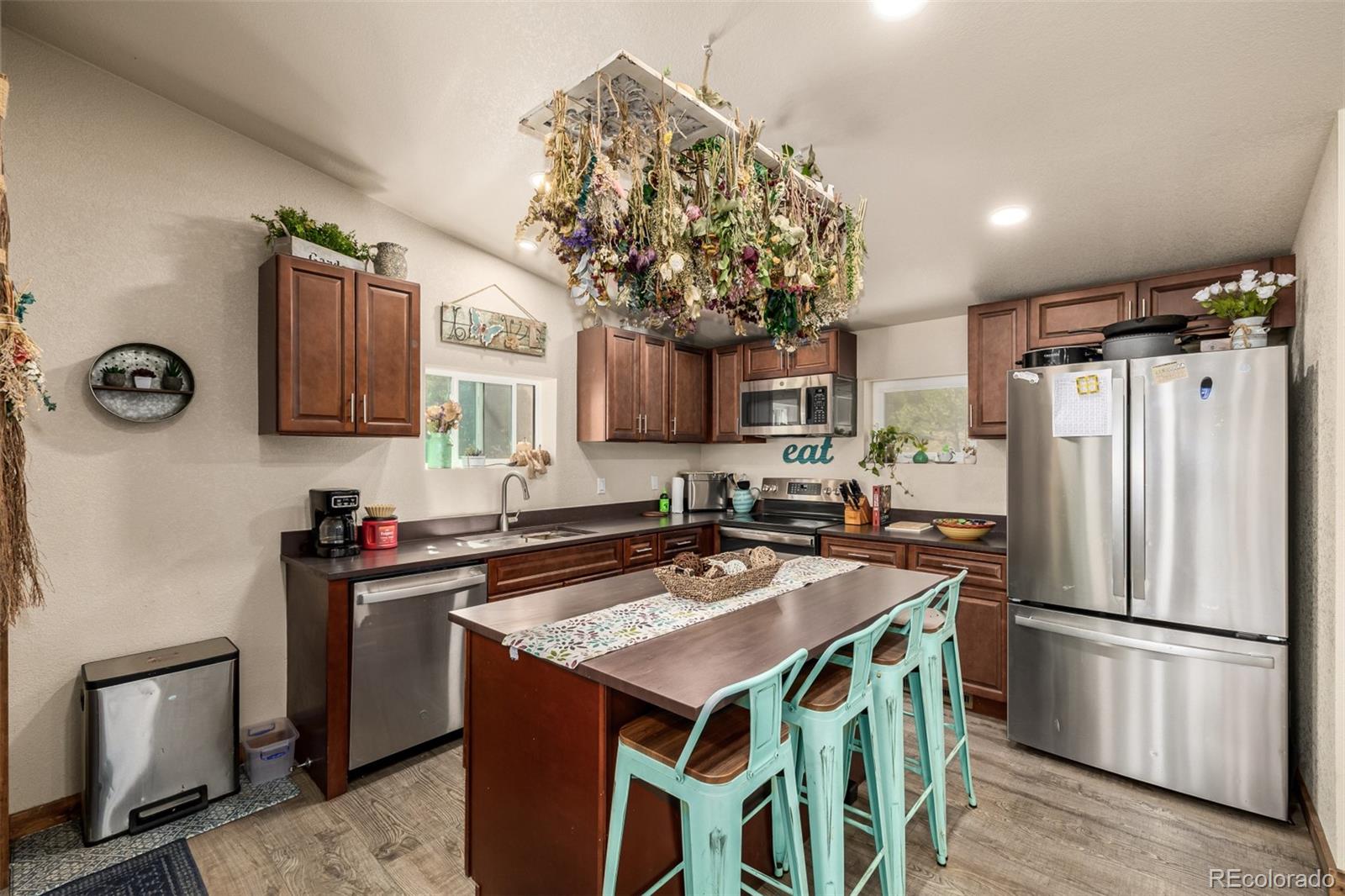 752 Impala Trail Bailey, CO 80421 - Photo 11 of 50 a kitchen with stainless steel appliances granite countertop a refrigerator a sink a stove and a refrigerator