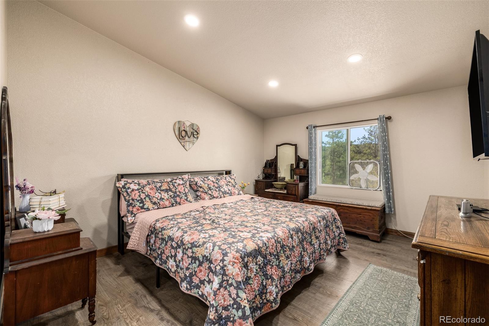 752 Impala Trail Bailey, CO 80421 - Photo 15 of 50 a bedroom with a bed and window