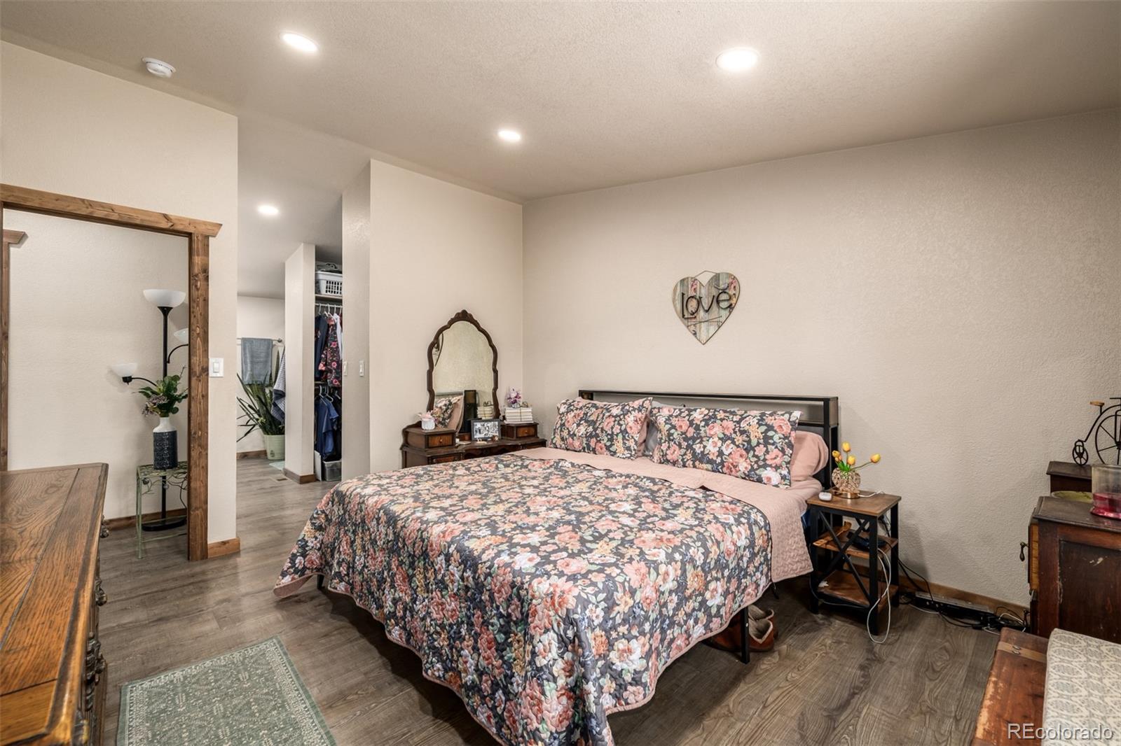 752 Impala Trail Bailey, CO 80421 - Photo 17 of 50 a bed sitting in a spacious bedroom next to a window