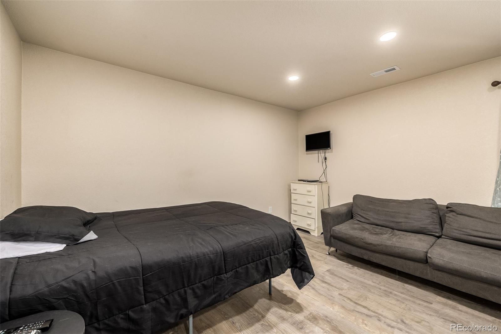 752 Impala Trail Bailey, CO 80421 - Photo 26 of 50 a bedroom with a bed and a couch