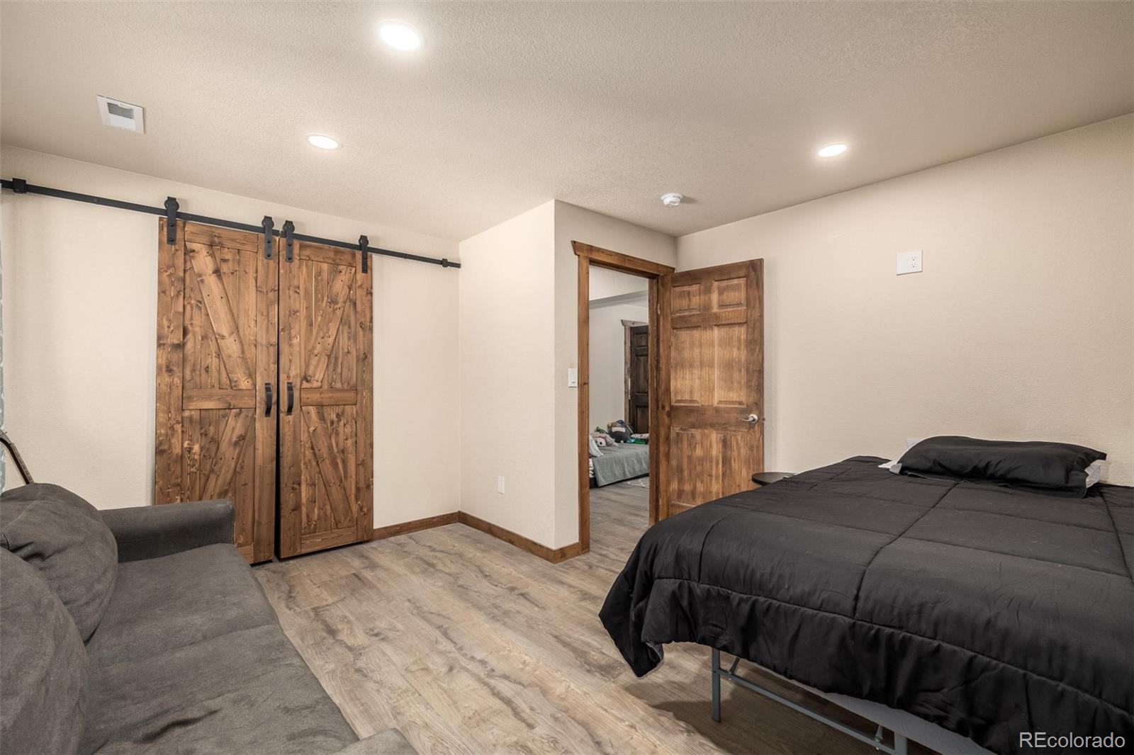 752 Impala Trail Bailey, CO 80421 - Photo 27 of 50 a bedroom with a bed and a closet