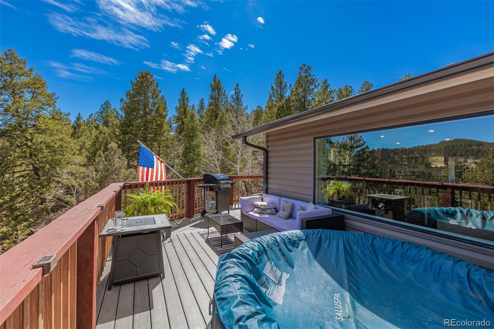 752 Impala Trail Bailey, CO 80421 - Photo 31 of 50 a view of a chairs and table in patio