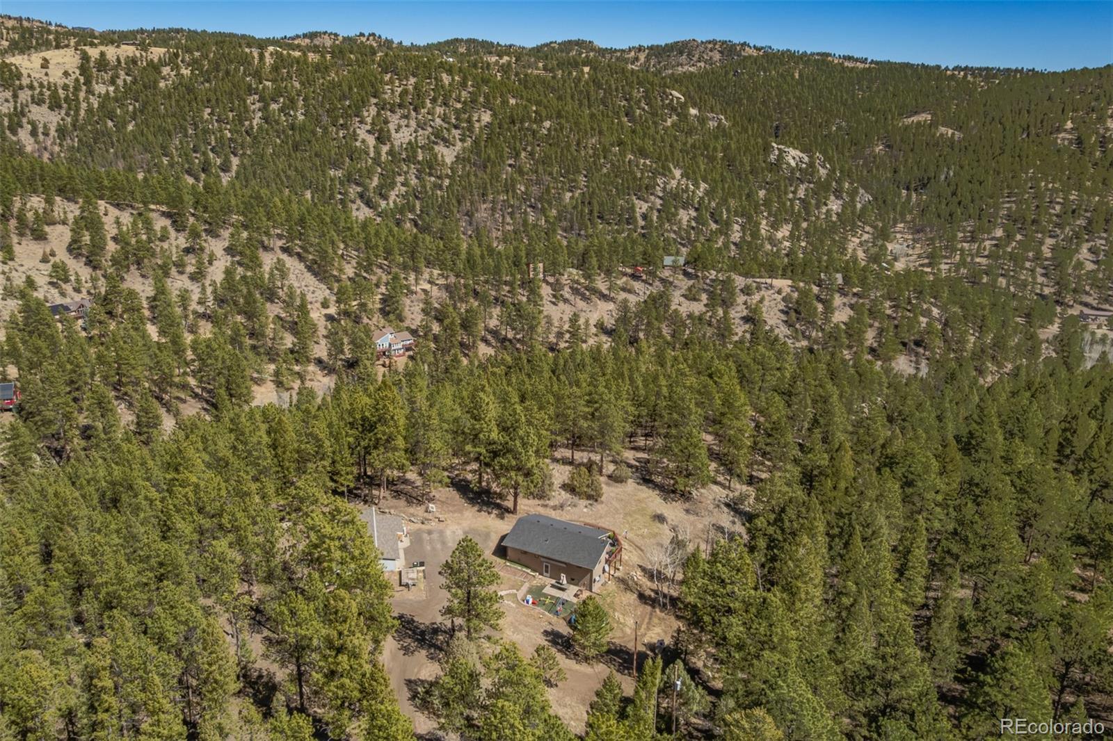 752 Impala Trail Bailey, CO 80421 - Photo 44 of 50 a view of a city with lush green forest