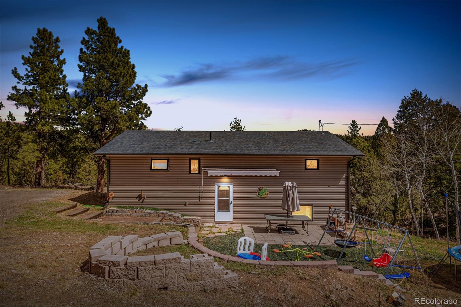 752 Impala Trail Bailey, CO 80421 - Photo 50 of 50 a view of a house with a patio