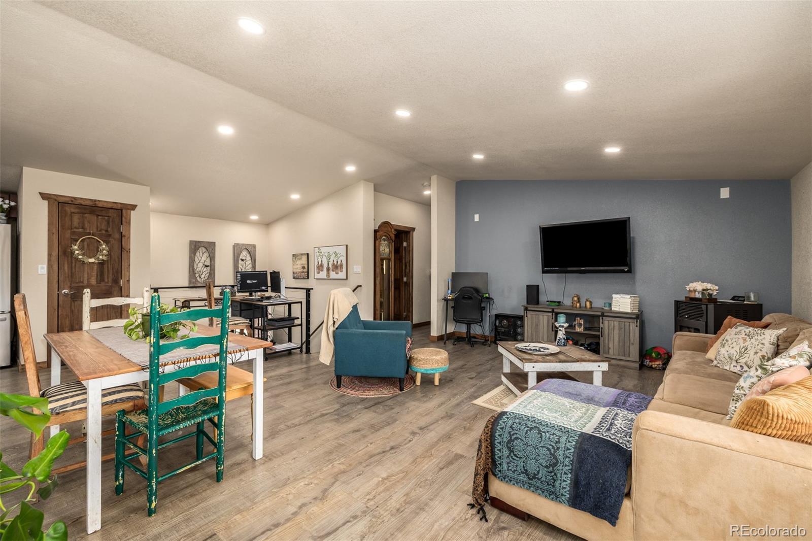 752 Impala Trail Bailey, CO 80421 - Photo 6 of 50 a living room with furniture and a flat screen tv