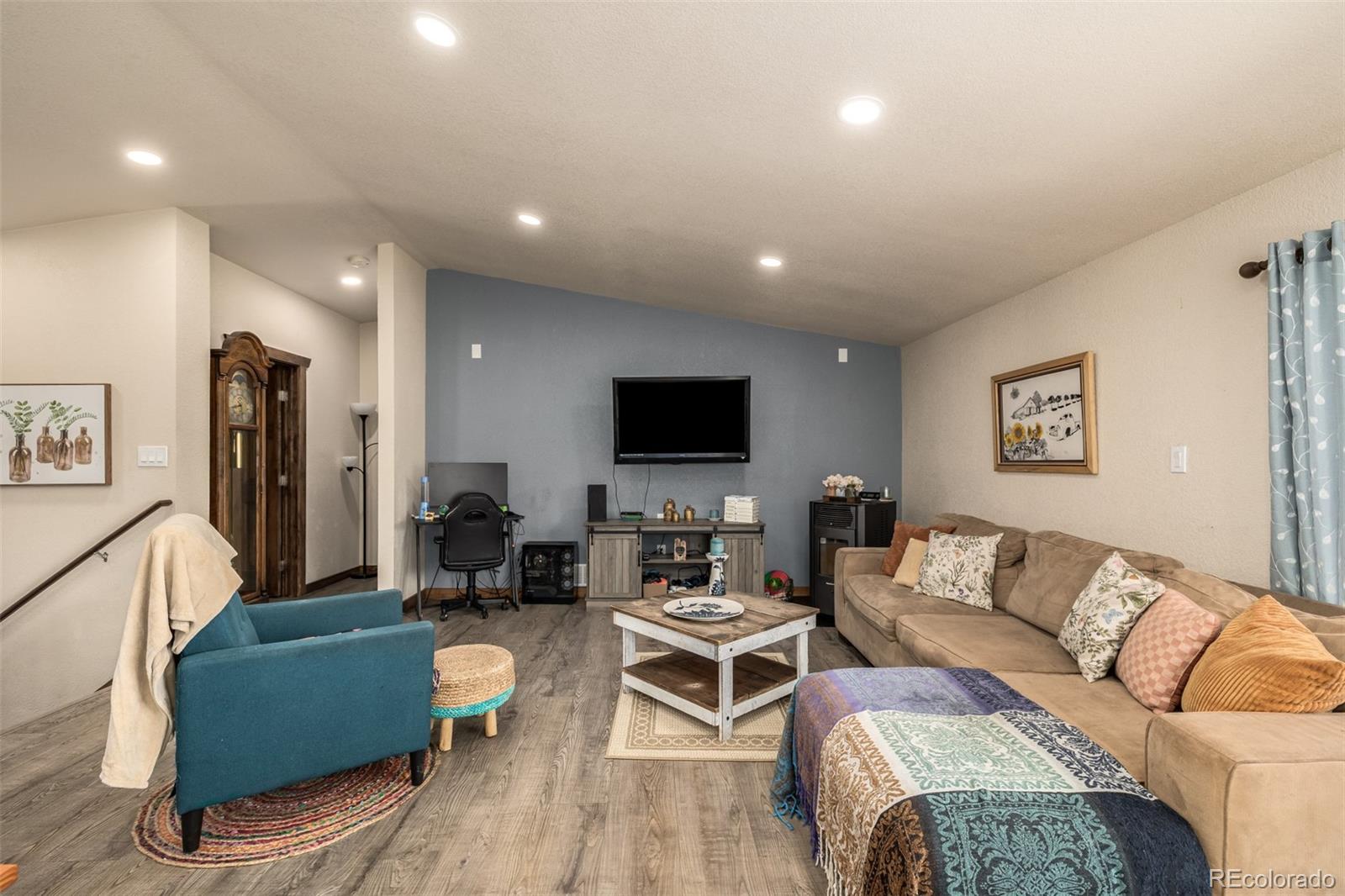 752 Impala Trail Bailey, CO 80421 - Photo 7 of 50 a living room with furniture and a flat screen tv