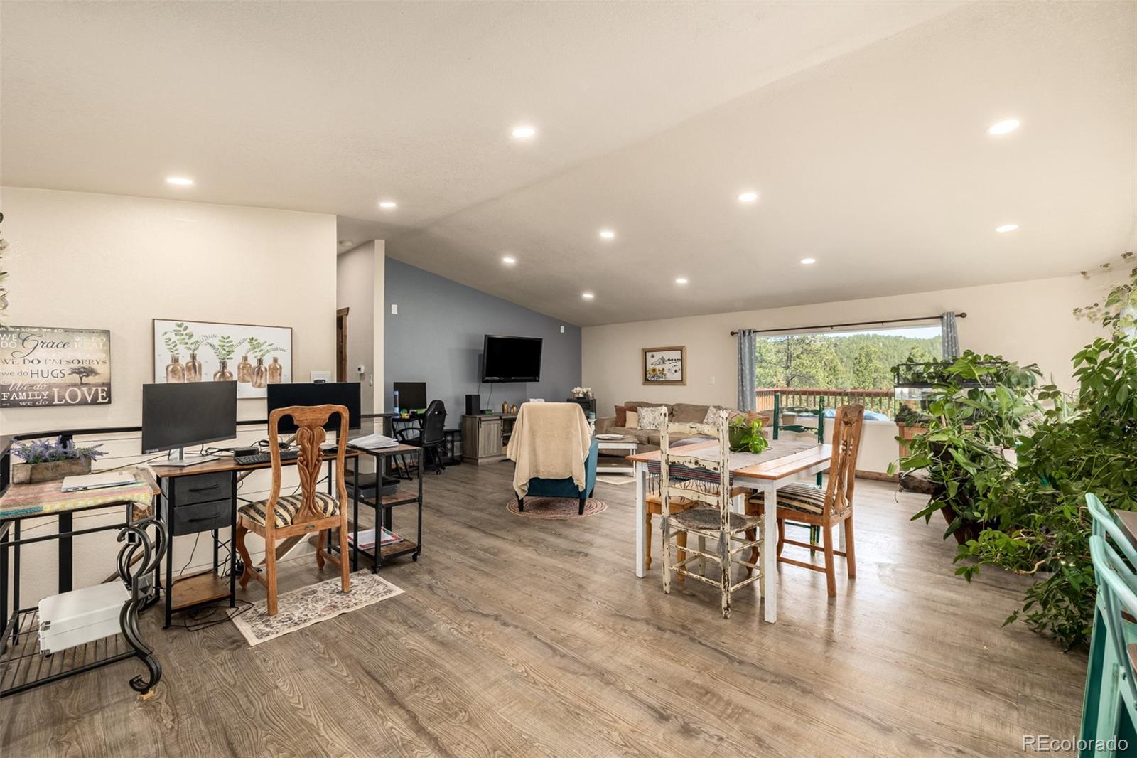 752 Impala Trail Bailey, CO 80421 - Photo 8 of 50 a group of people sitting in a living room