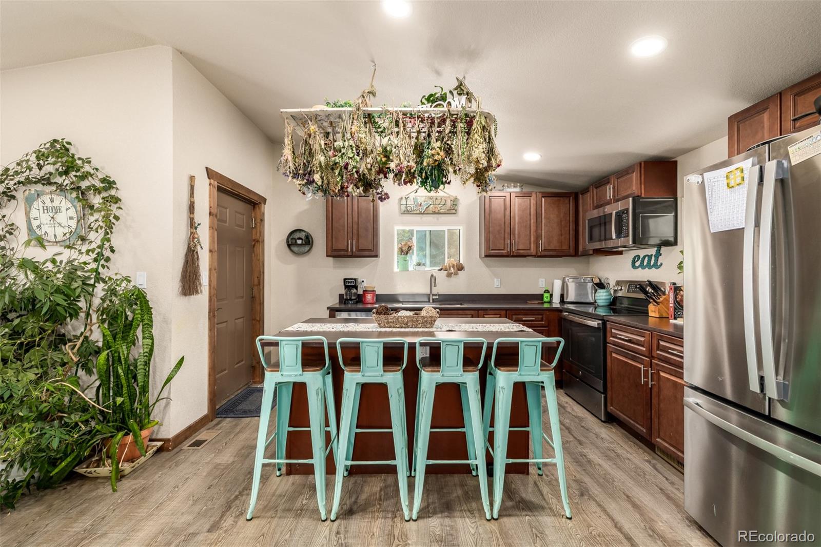 752 Impala Trail Bailey, CO 80421 - Photo 10 of 50 a view of a dining room with furniture window and wooden floor