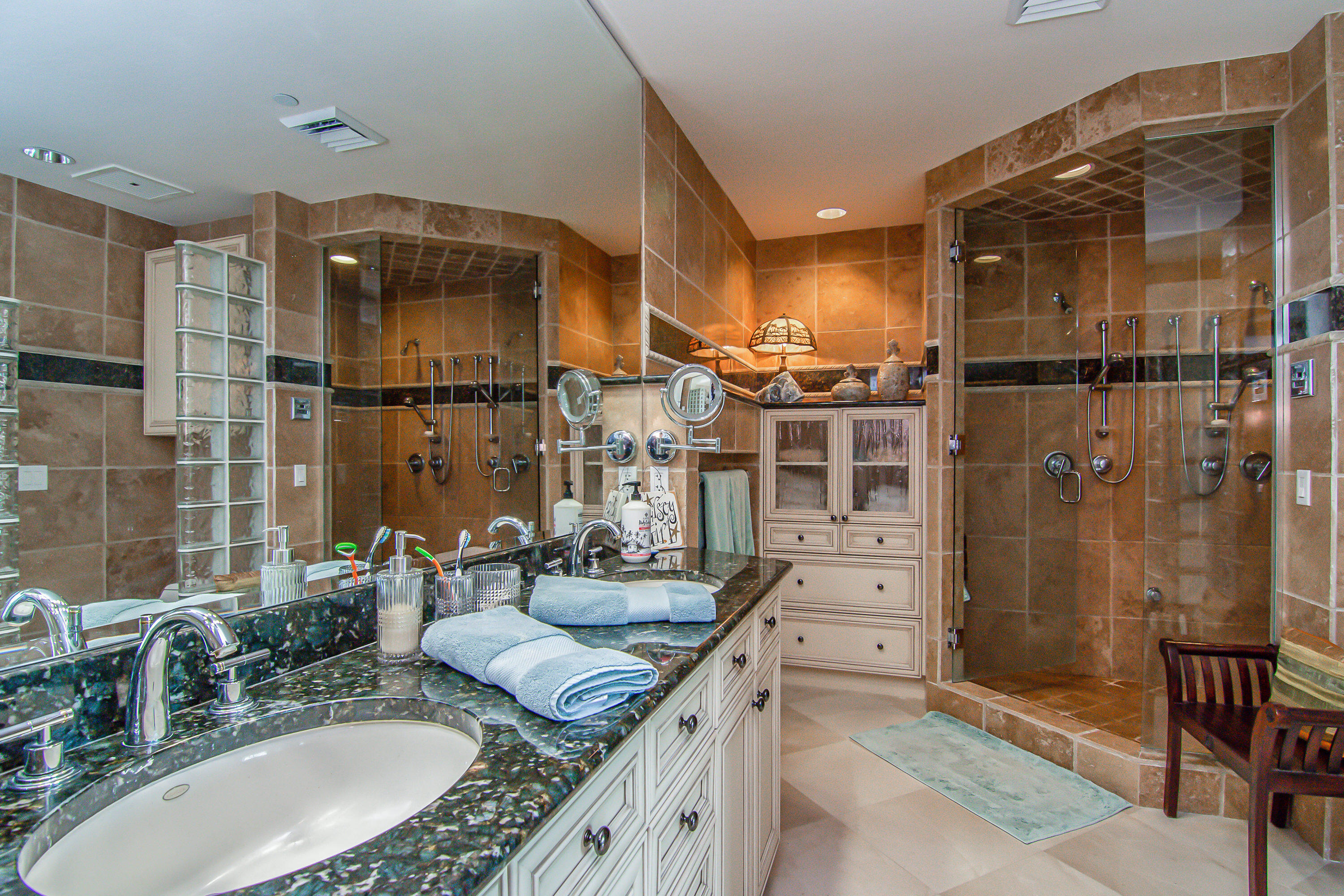 1069 Bald Eagle Drive, Unit S803 Marco Island, FL 34145 - Photo 12 of 41 a bathroom with a granite countertop sink mirror and shower