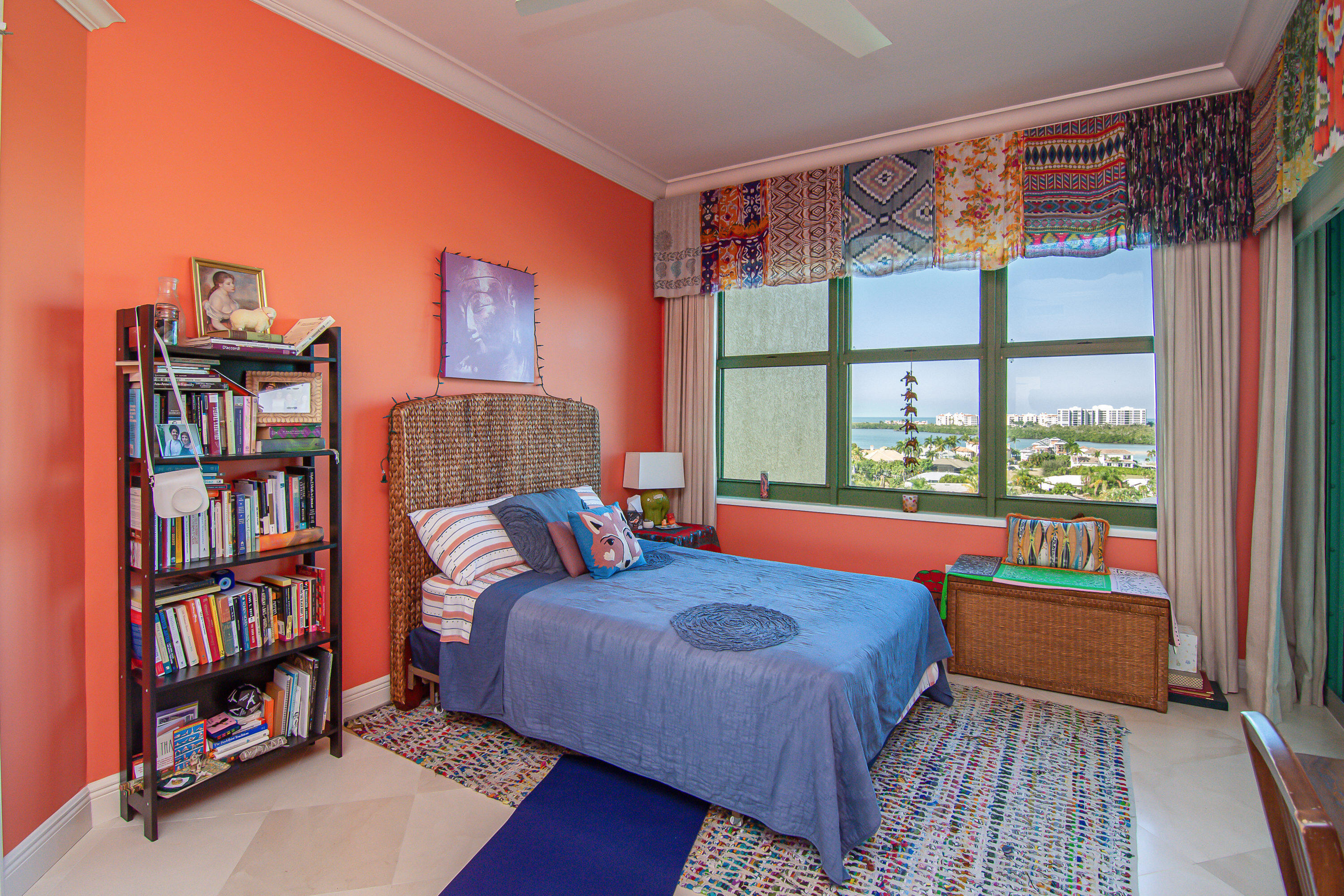 1069 Bald Eagle Drive, Unit S803 Marco Island, FL 34145 - Photo 15 of 41 a bedroom with a bed and a book shelf