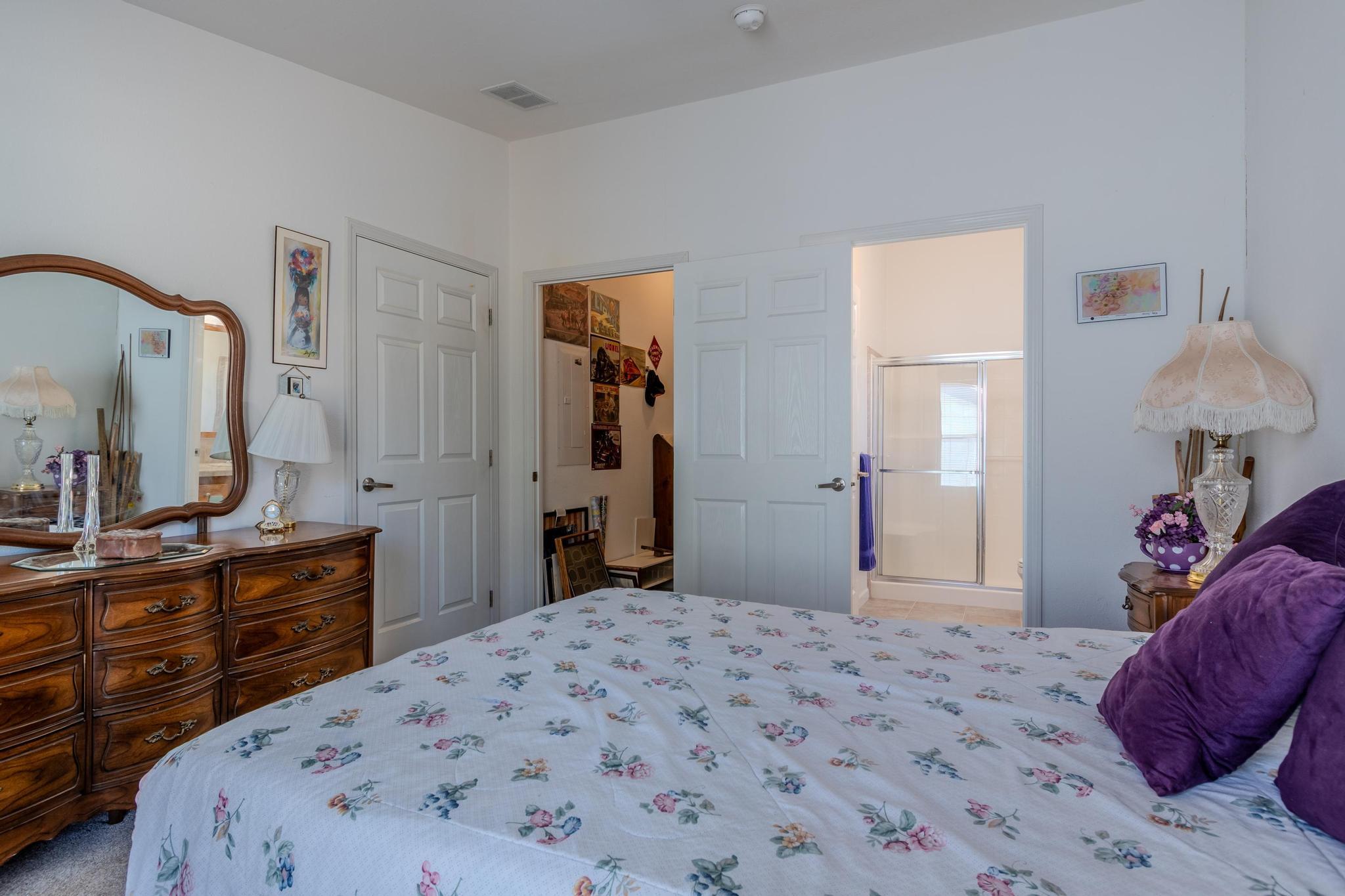 187 East Gregory Road Central Point, OR 97502 - Photo 22 of 29 a bedroom with a bed and a dresser in it