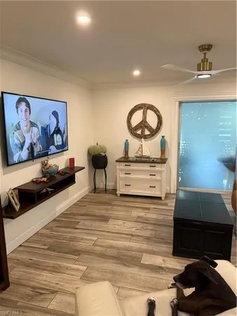 a living room with furniture and a mirror