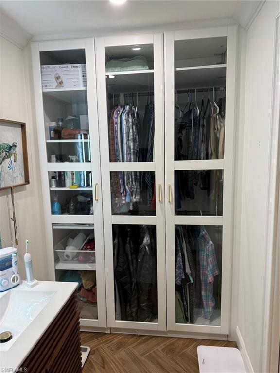 27044 Williams Road Bonita Springs, FL 34135 - Photo 6 of 27 a view of a hallway with wooden floor and a window