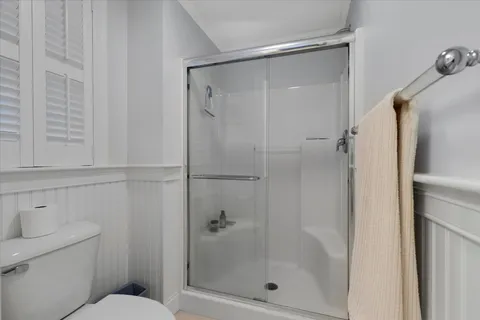 a kitchen with cabinets and wooden floor