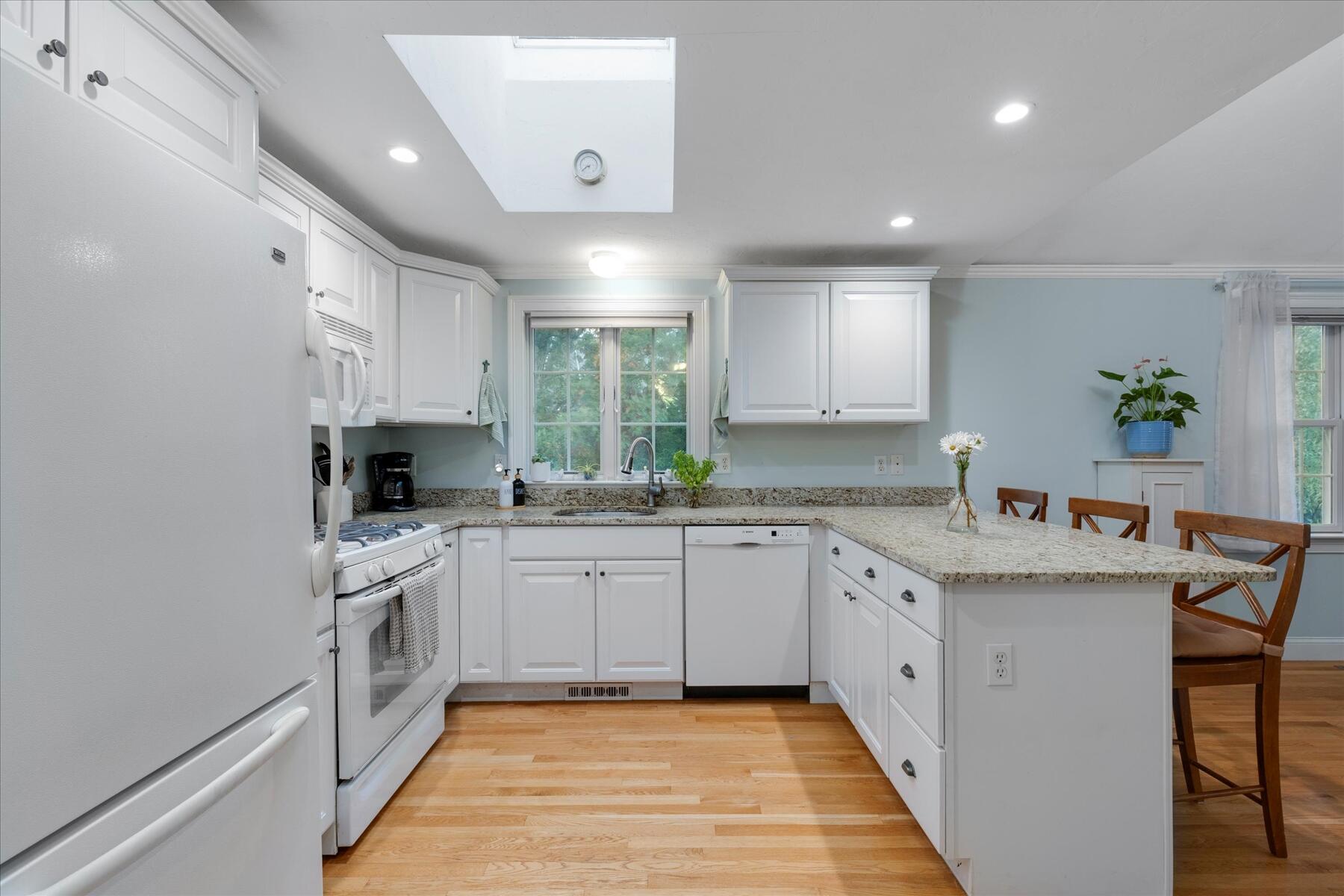 72 Dory Lane Eastham, MA 02642 - Photo 15 of 57 a large kitchen with stainless steel appliances granite countertop a sink and dishwasher a stove with wooden floor