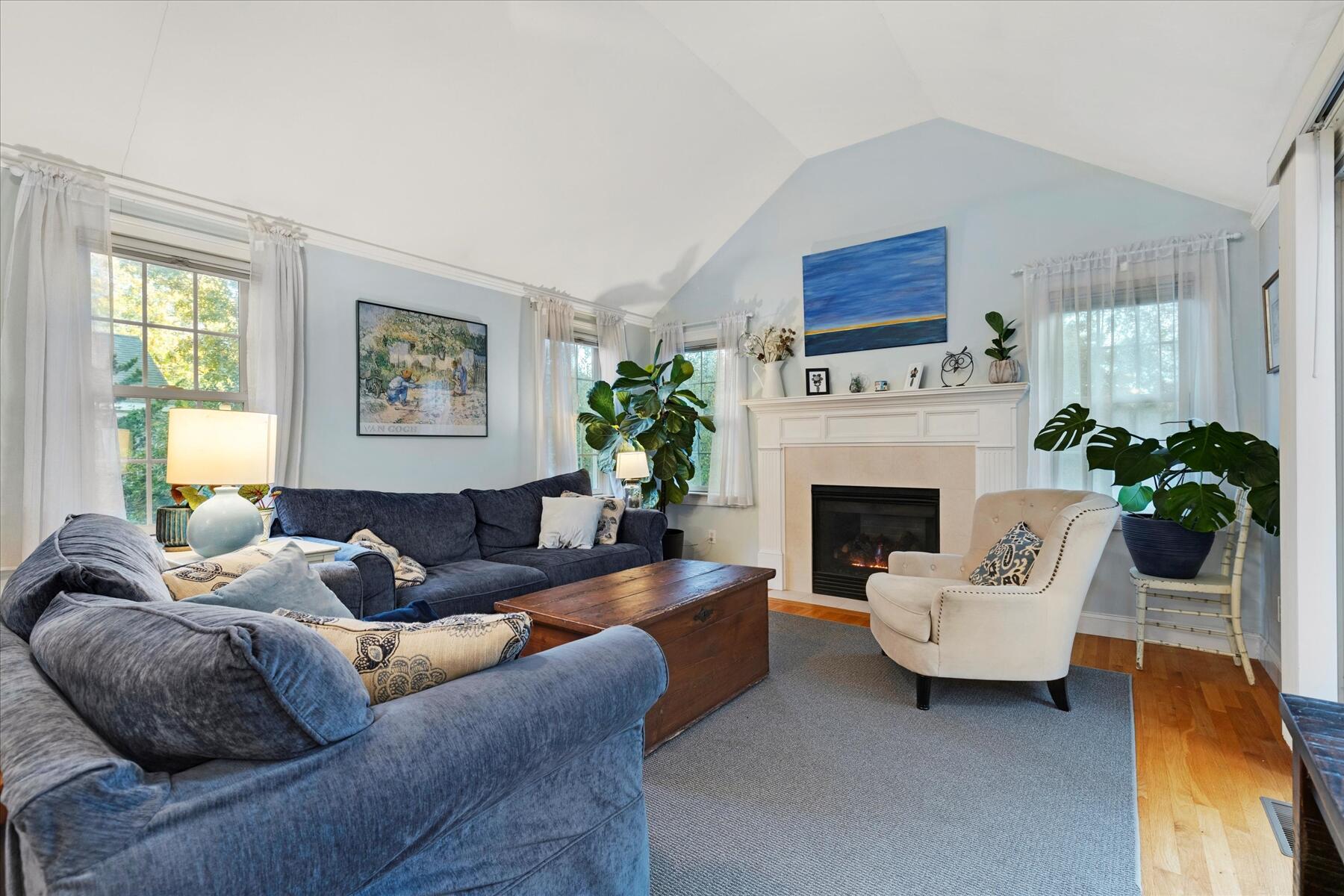 72 Dory Lane Eastham, MA 02642 - Photo 20 of 57 a living room with furniture and a fireplace