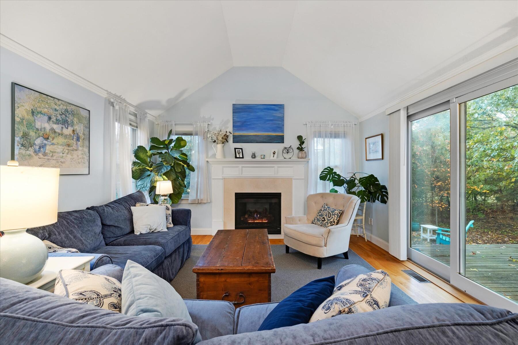 72 Dory Lane Eastham, MA 02642 - Photo 21 of 57 a living room with furniture and a fireplace