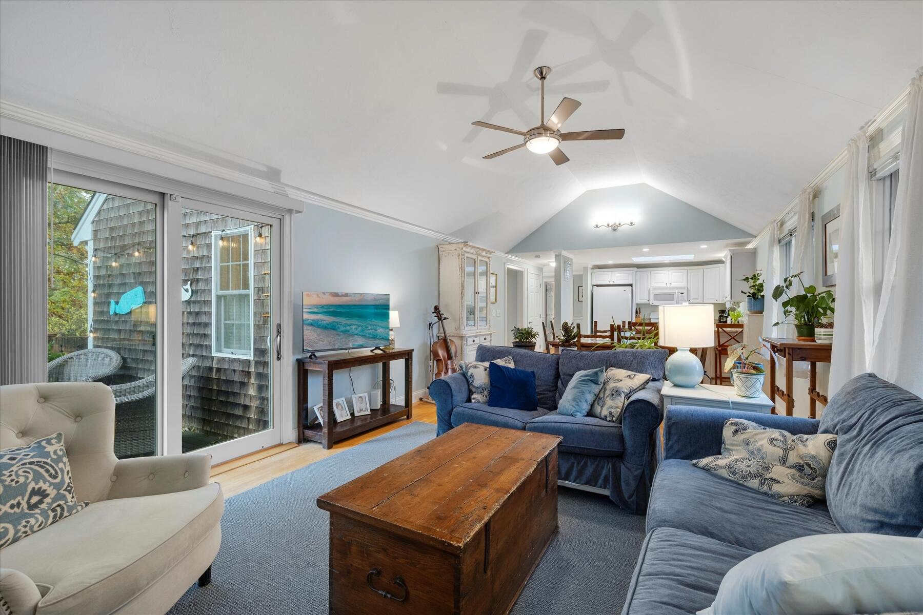 72 Dory Lane Eastham, MA 02642 - Photo 22 of 57 a living room with furniture ceiling fan and a wooden floor