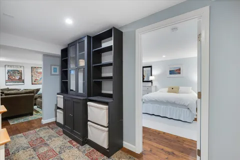 a bedroom with a bed and a dresser in it