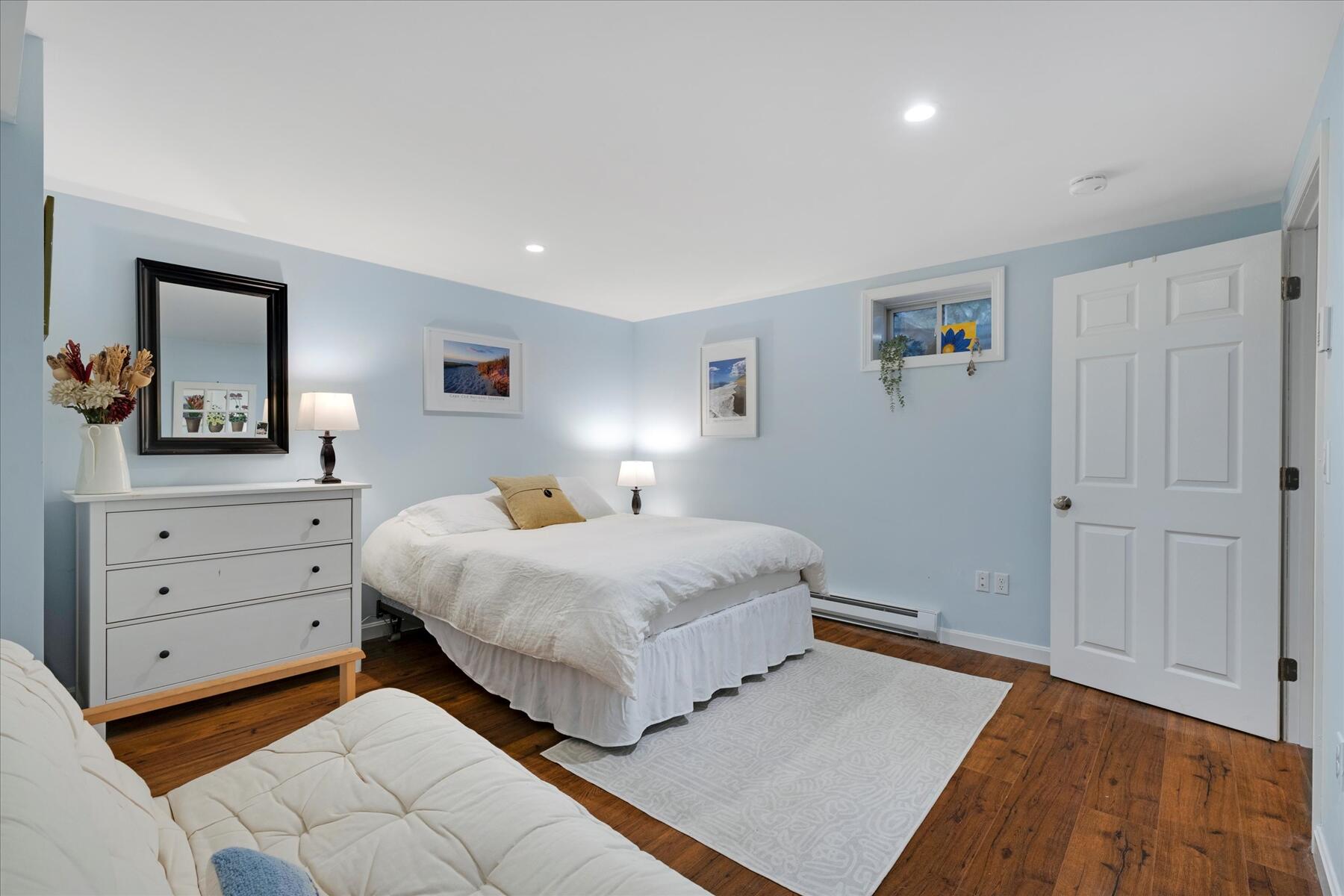 72 Dory Lane Eastham, MA 02642 - Photo 31 of 57 a bedroom with a bed and a dresser in it