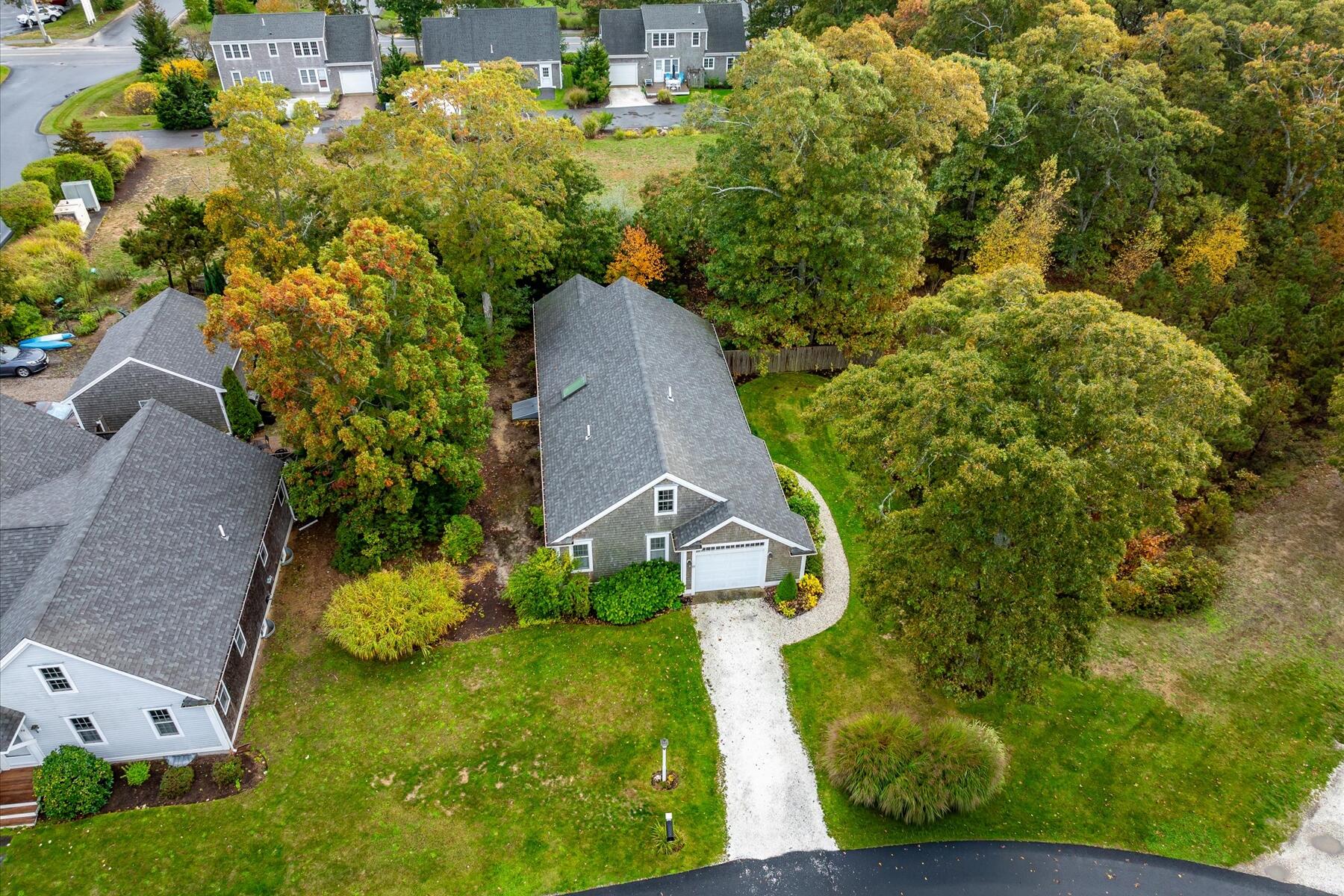 72 Dory Lane Eastham, MA 02642 - Photo 40 of 57 an aerial view of a house with a yard basket ball court and outdoor seating