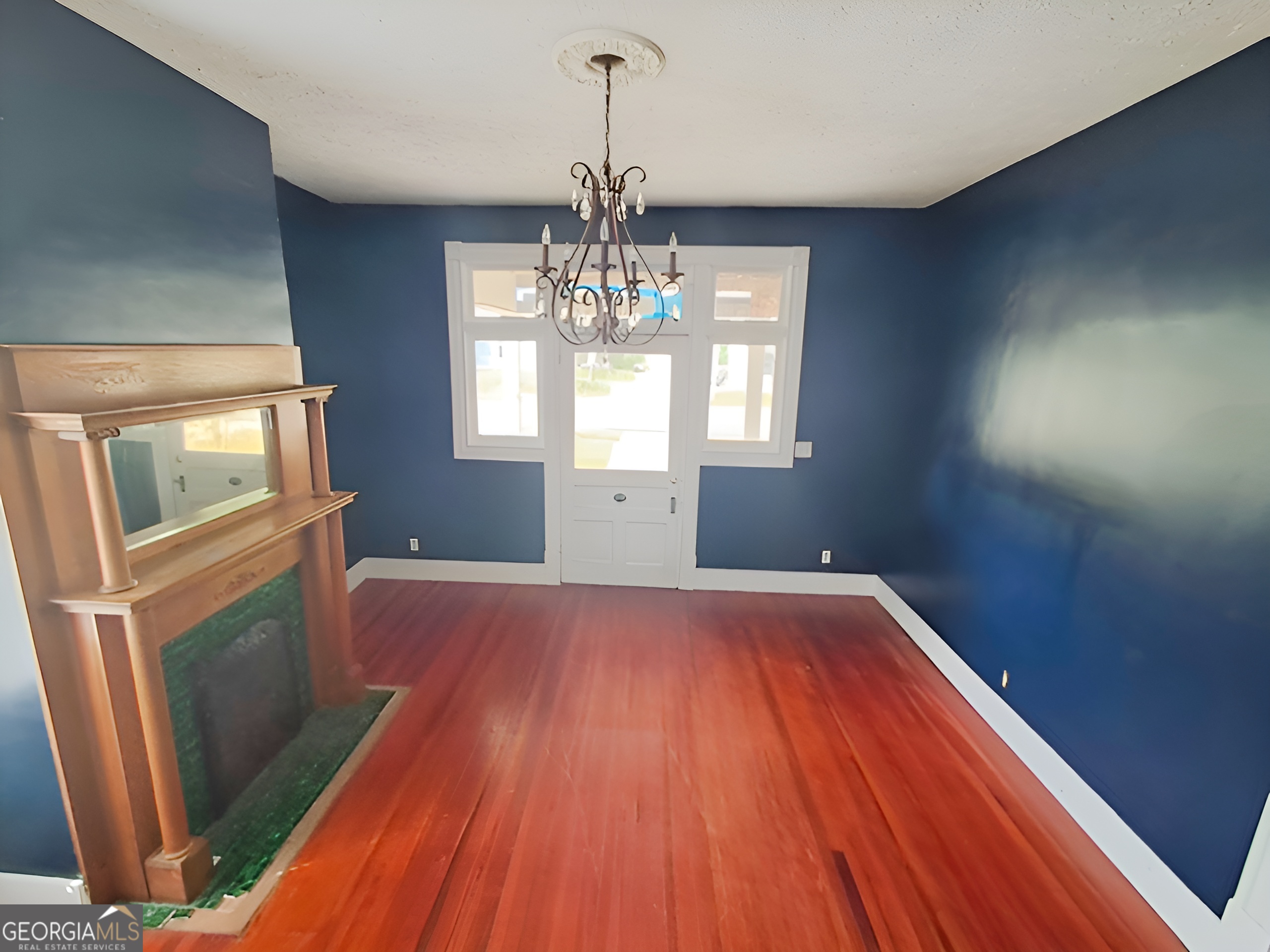 401 Forsyth Street Barnesville, GA 30204 - Photo 6 of 25 a view of empty room with wooden floor and fan