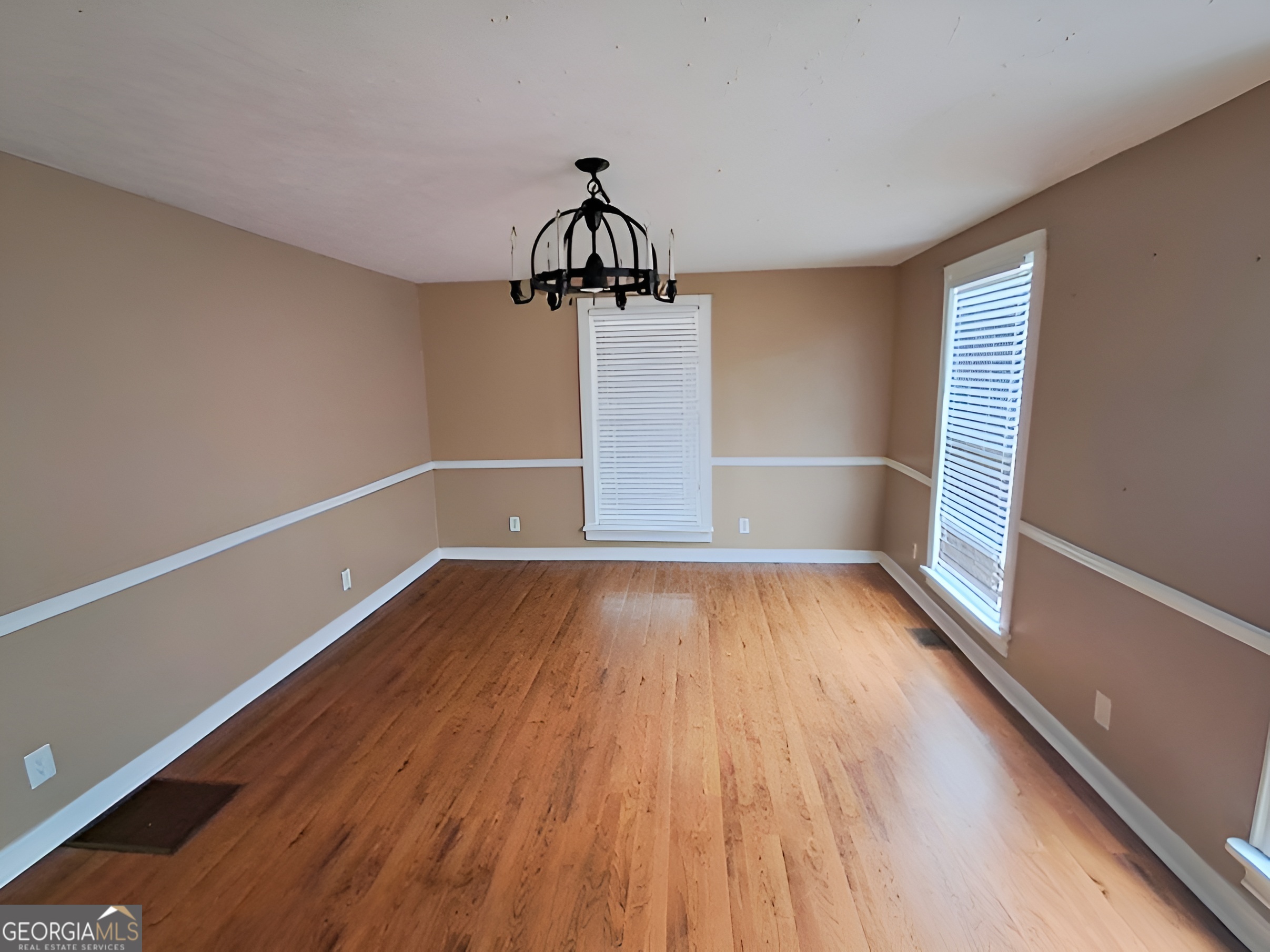 401 Forsyth Street Barnesville, GA 30204 - Photo 9 of 25 a view of a room with wooden floor and window