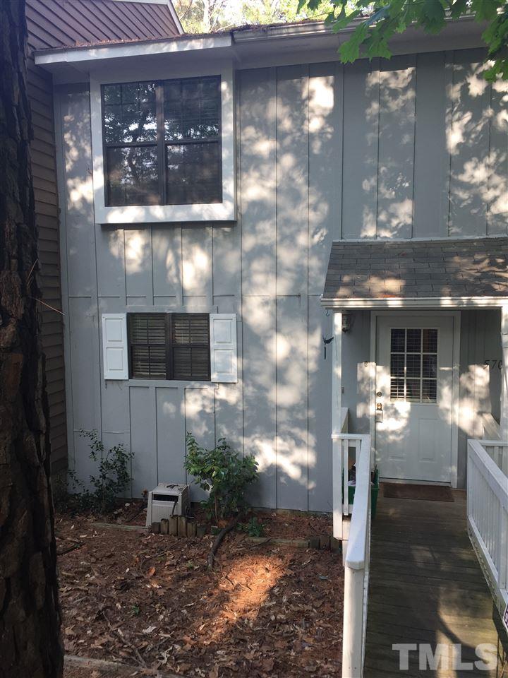 5702 3 Oaks Drive Raleigh, NC 27612 - Photo 2 of 18 a front view of a house with entryway