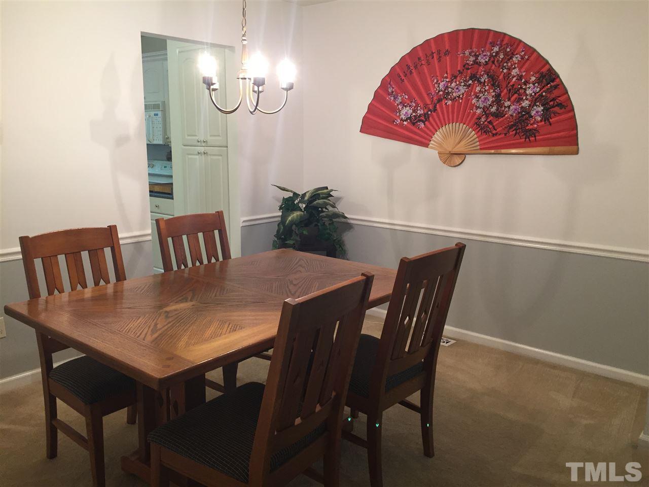 5702 3 Oaks Drive Raleigh, NC 27612 - Photo 5 of 18 a view of a dining room with furniture