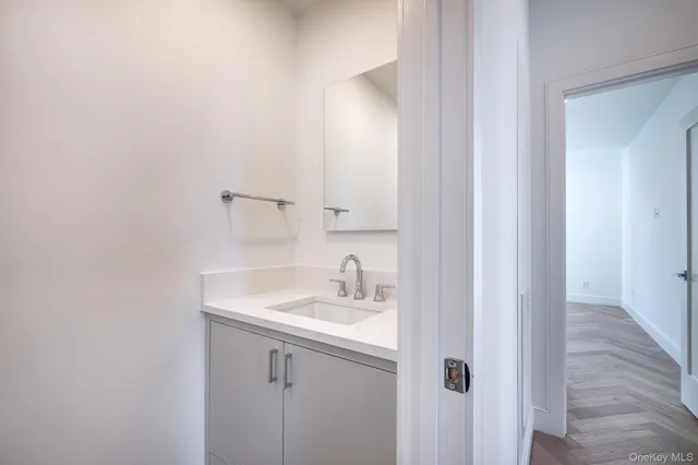 a bathroom with a sink and a mirror