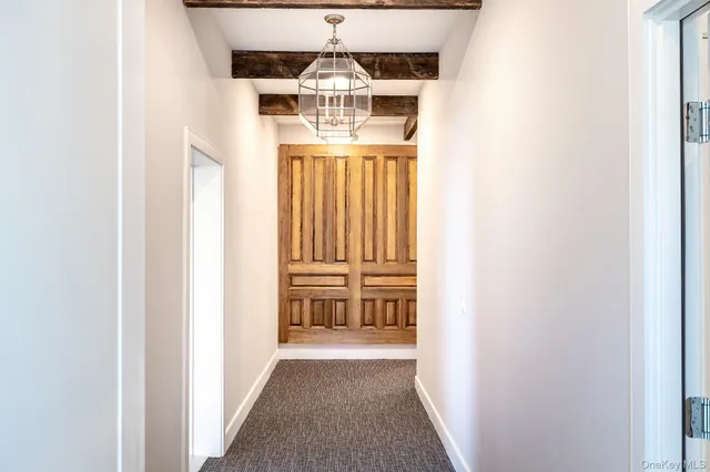a view of a hallway with a door