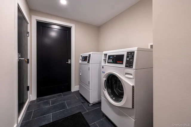 a view of a storage & utility room with washer and dryer