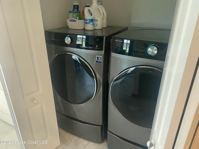 a utility room with dryer and washer