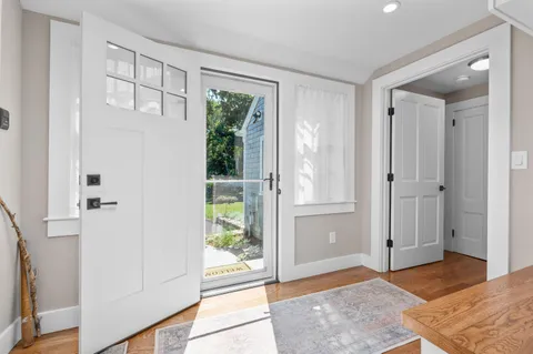 a view of entryway with wooden floor and garden