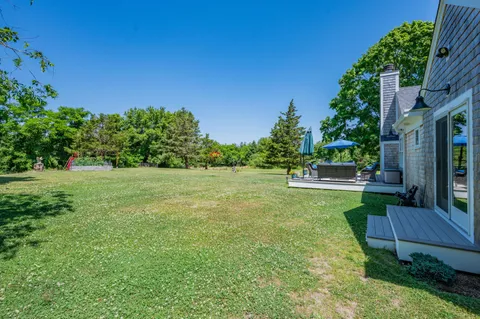 a view of a garden with a bench in a garden