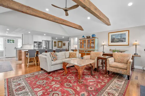 a living room with lots of furniture and a rug